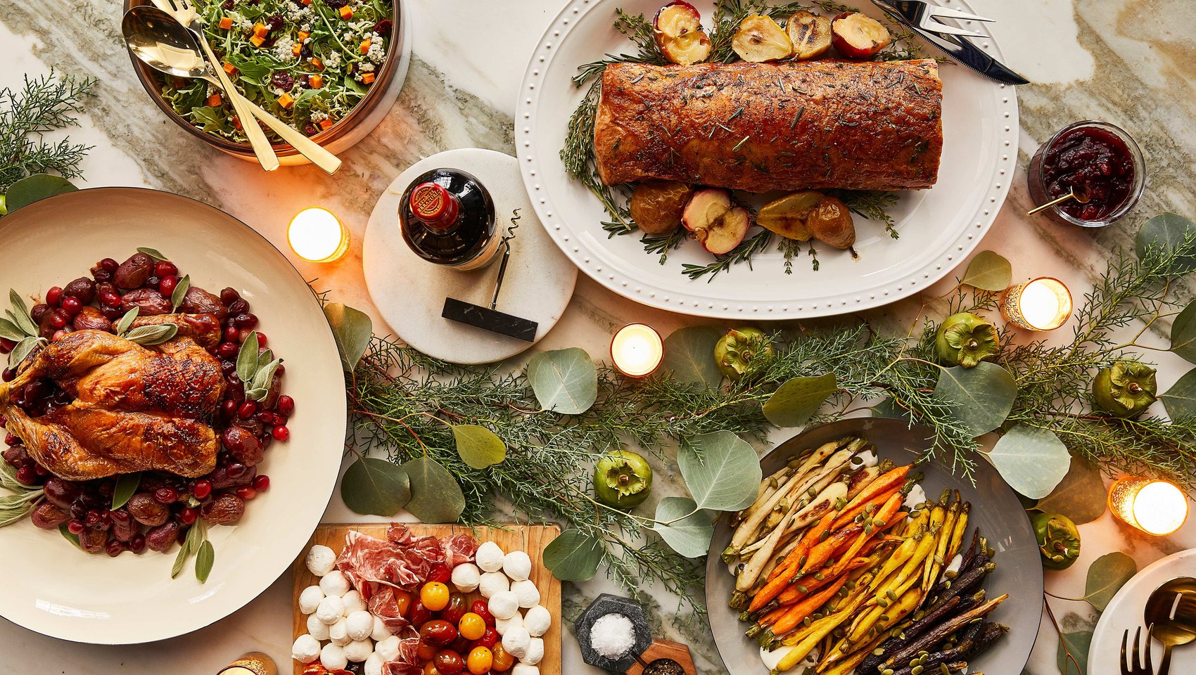 Family-style holiday tablescape with roast turkey, seasonal vegetables, and candlelight.
