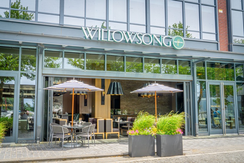 Exterior of Willowsong restaurant with open-air patio seating.